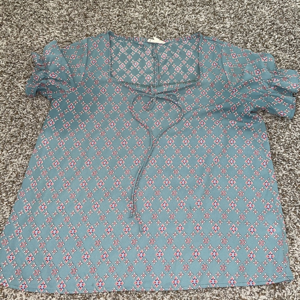 Top with ruffle sleeves